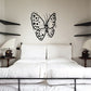 Butterfly wall decal with black dotted wings and central antenna detail