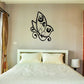 Black butterfly wall vinyl decal with rocket-like design, whimsical outline