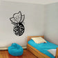 Black butterfly vinyl wall decal with stylized face and antennae