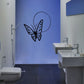 Butterfly vinyl wall decal: black winged butterfly with dotted pattern and swirl outline.