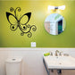 Butterfly wall decal vinyl in black with curled accents, centered on a light wall