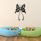 Butterfly wall decal: black vinyl butterfly with swirled wings and hanging body