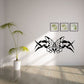 Butterfly vinyl wall decal with ornate wings and center bow, black and white