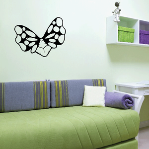 Butterfly wing masquerade mask wall decal with black outlined wings and white details