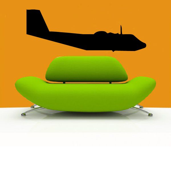 Green cushioned swivel lounge chair with black base