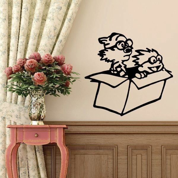 Wall decal of two cartoon characters popping from an open box.