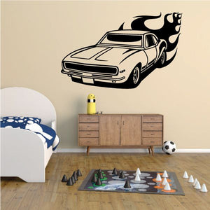 Car wall decal with flame graphics behind a classic vehicle
