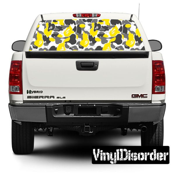 Camouflage rear window graphic with yellow and black pattern on light background