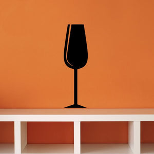 Champagne flute decal, black silhouette on flat surface