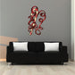 Candy cane sticker with red and white stripes and looping red ribbon curls
