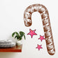 Candy cane Christmas decal with brown-and-white stripes and pink star shapes