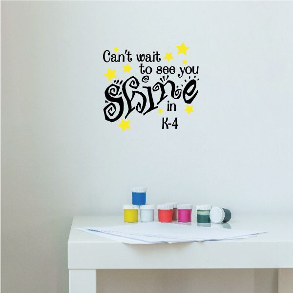 Decorative wall decal with black lettering and yellow stars, 'shine in K-4'