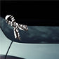 Awareness ribbon vinyl sticker with black and white zebra-striped ribbon on car window