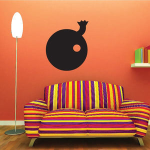 Cartoon bomb decal with black circular shape and small fuse icon