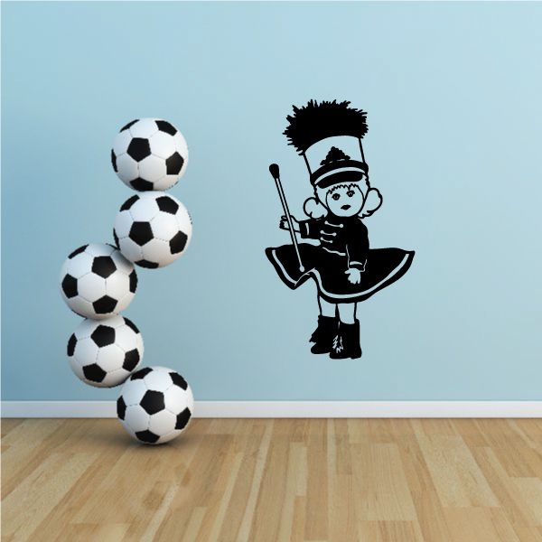Cartoon drum major decal with black hat figure holding batons and soccer ball cluster