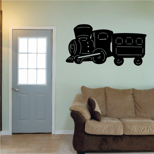 Black cartoon train wall decal with chimney, wheels, and smokebox