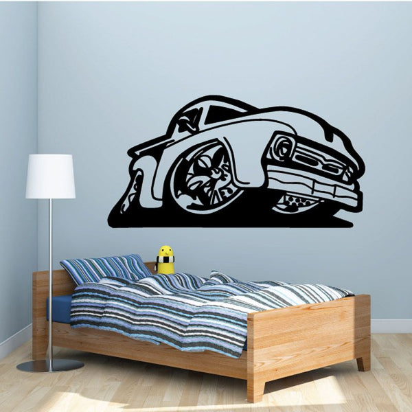 Cartoon truck wall decal with bold black-and-white outline and wheels