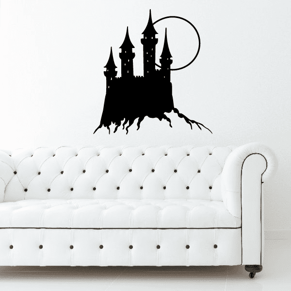 Castle and Moon wall decal: black castle silhouette with moon over white tufted sofa
