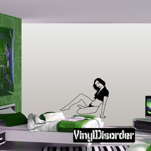 Relaxing lounging woman vinyl decal, black line art on a rectangular background