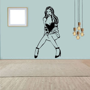 Wall decal with black line art of a woman in robe and high heels, standing pose