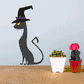 Black cat sticker wearing tall black witch hat with purple band and yellow eyes
