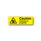 Yellow caution sticker: triangle hazard icon, 'Caution—Cleaning in progress'