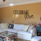 Wall decal with black 'Celebrate Love' script lettering