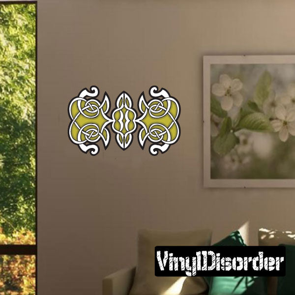 Celtic knot rectangle sticker in black and gold on a wall