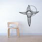 Black cross-shaped creature wall decal with horned skull face and spikes
