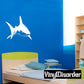 Shark decal with a white swimming shark silhouette on a blue surface