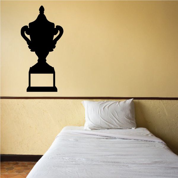 Championship trophy wall silhouette with cup and two handles on a rectangular base