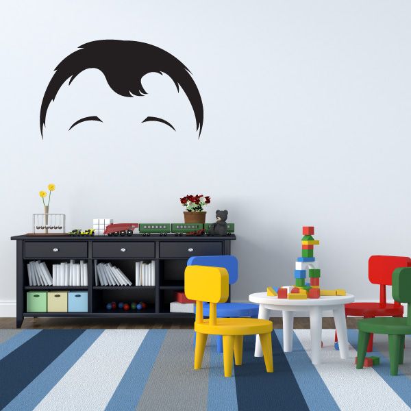 Vinyl cartoon character face wall decal with dark hair and pale face