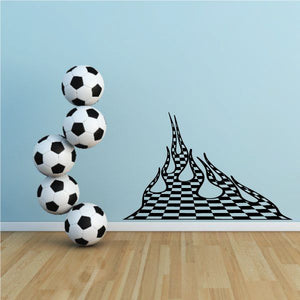 Vinyl wall decal of black-and-white checkered flame design with soccer balls