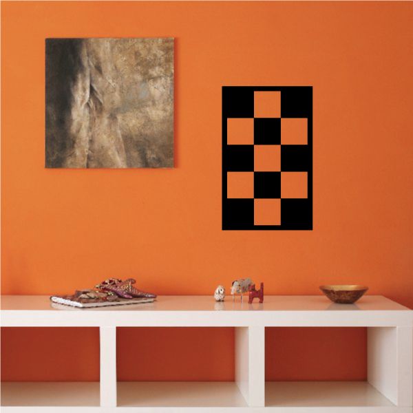 Checkered wall decal with black and orange square pattern