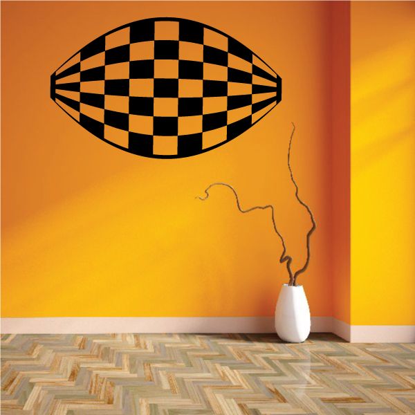 Checkered football-shaped wall decal in black and tan