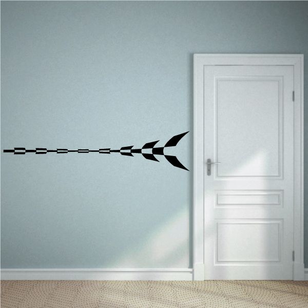 Checkered pattern vinyl wall decal with arrow shape, black and white