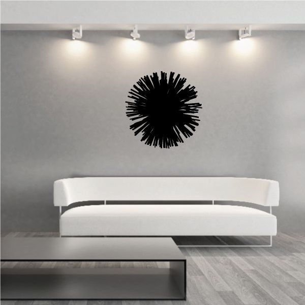 Cheerleading pom-pom wall decal, black vinyl burst above a sofa
