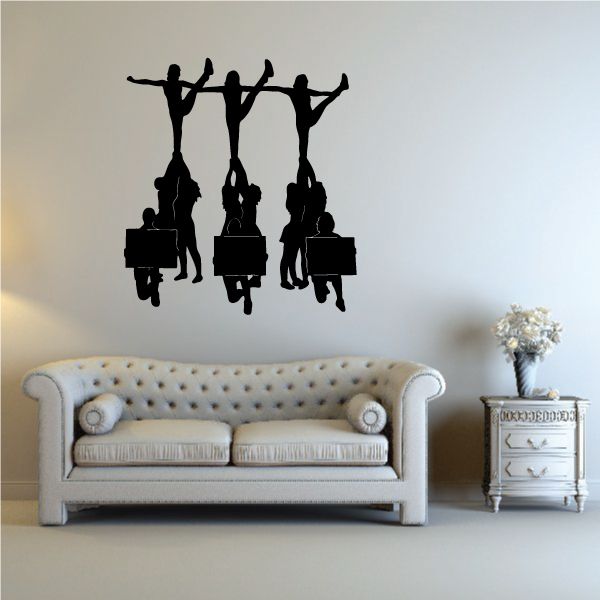 Cheerleading wall decal with black cheerleader silhouettes holding pom-poms