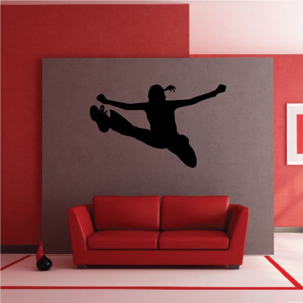 Cheerleading cheer wall decal: black cheerleader silhouette mid-jump on gray