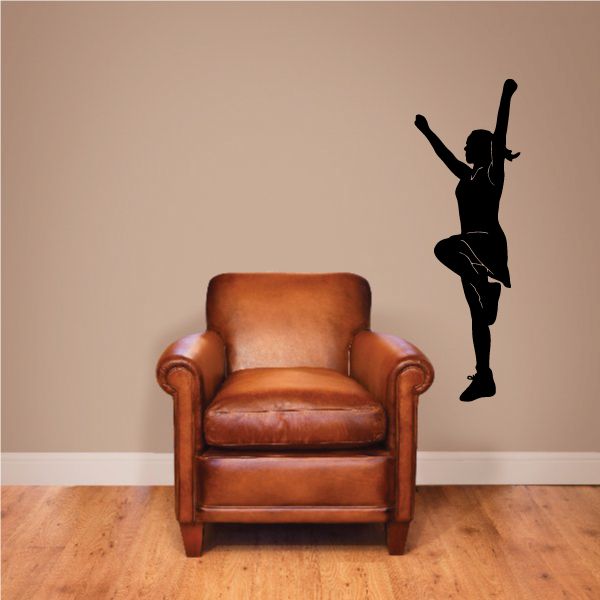 Cheerleading wall decal with black cheerleader silhouette and pom-poms