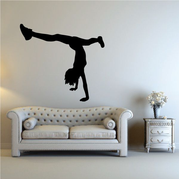 Black cheerleader vinyl wall decal silhouette doing a cheer pose with raised arm.