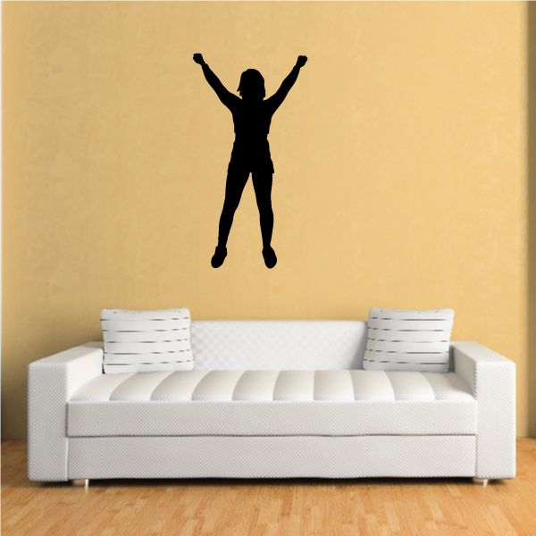 Cheerleading wall decal of a black cheerleader silhouette with arms raised