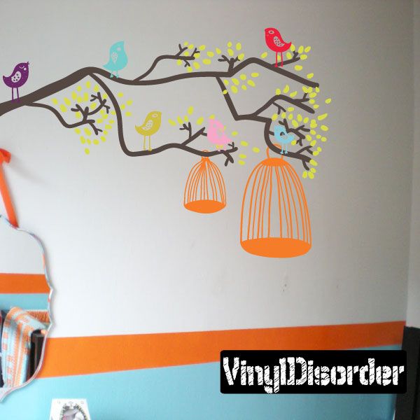 Colorful bird and birdcage wall decal with branching vines, hanging cages, and small leaves