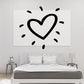 Black heart outline decal with playful rays and small dash accents