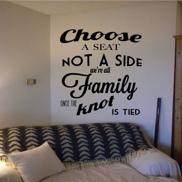 Wedding quote wall decal with black lettering: 'Choose a seat not a side, family'.