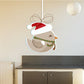 Christmas bird ornament sticker with bow, scarf, and hat on a crescent moon