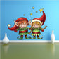 Christmas elf helpers sticker with two cartoon elves in red hats, green outfits, and gold stars
