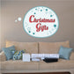 Round sticker with teal border, blue stars, and red text reading "Christmas Giga"
