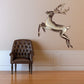 Jumping reindeer Christmas wall sticker: white and brown reindeer with antlers.