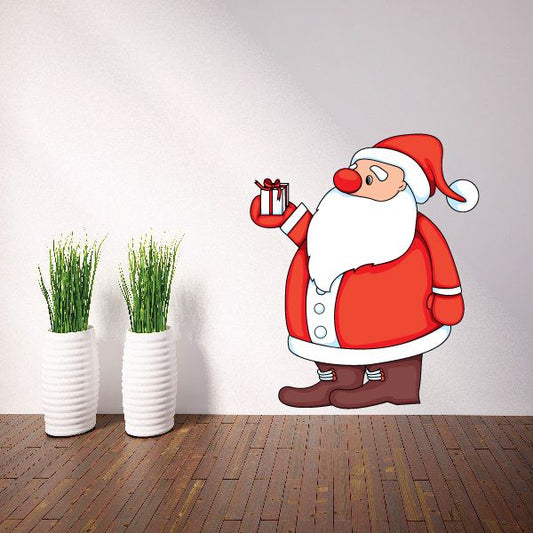 Image of Christmas Santa Holding Small Gift Sticker